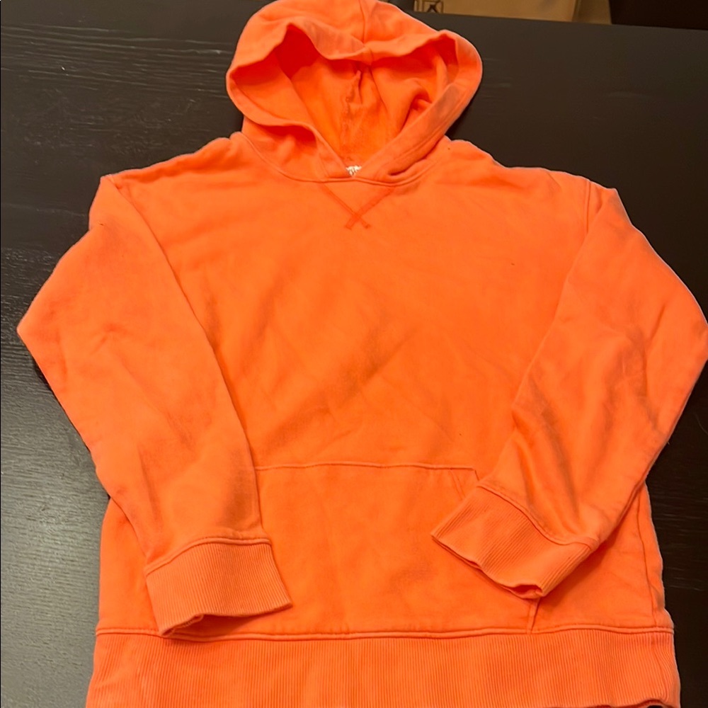 Coral color hooded sweatshirt for girls.